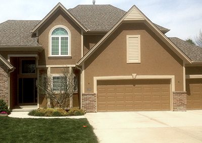 Exterior painting project image of local house with brown and cream paint.