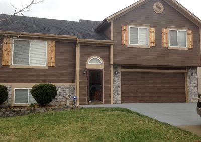 Exterior painting project image of local house with brown and tan paint.