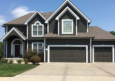 Exterior painting project image of local house with brown and white paint.